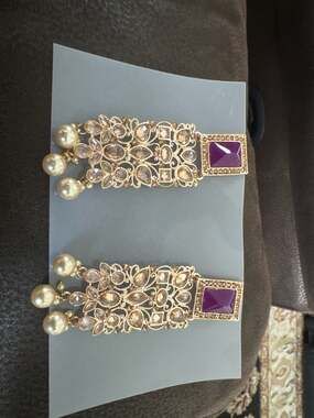 Antique Gold Finish Kundan Style Dangle Earrings with Purple Stones and Faux Pea